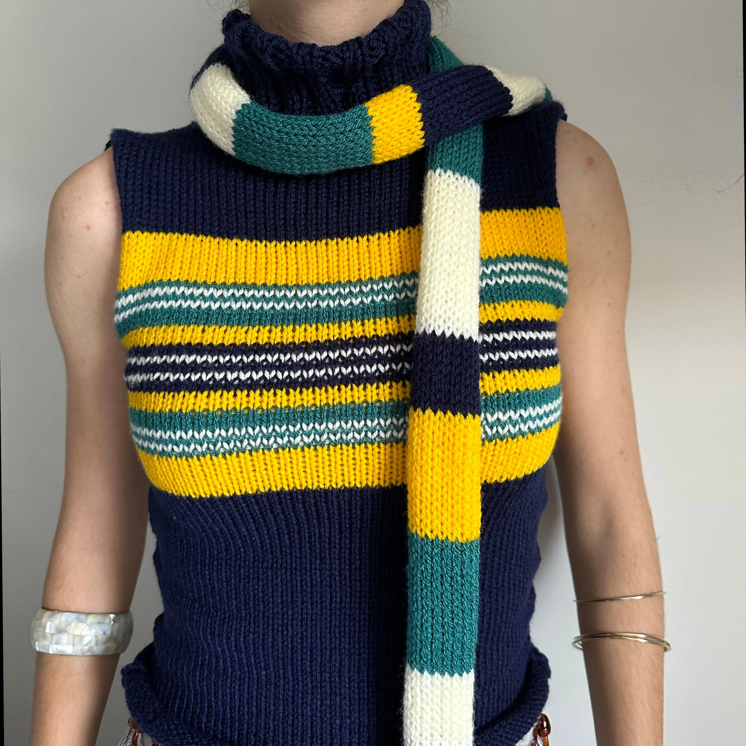 Handmade knitted stripy skinny scarf in navy, cream, yellow and teal